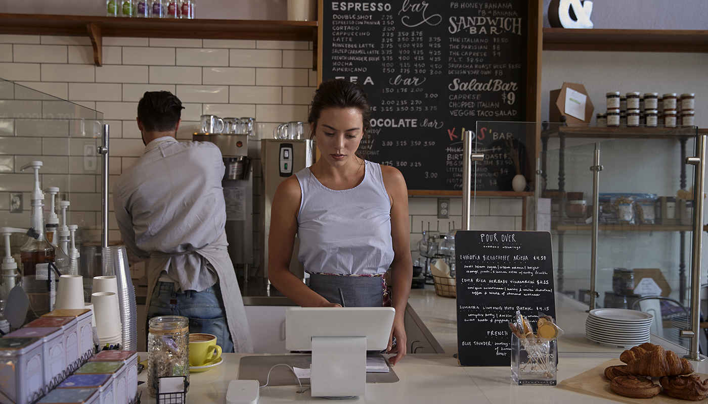 Lady serving a cafe counter