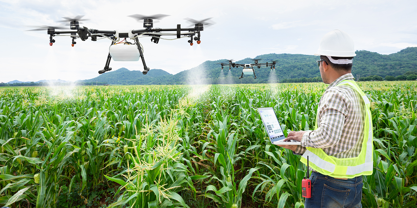 Man watering plants with drones