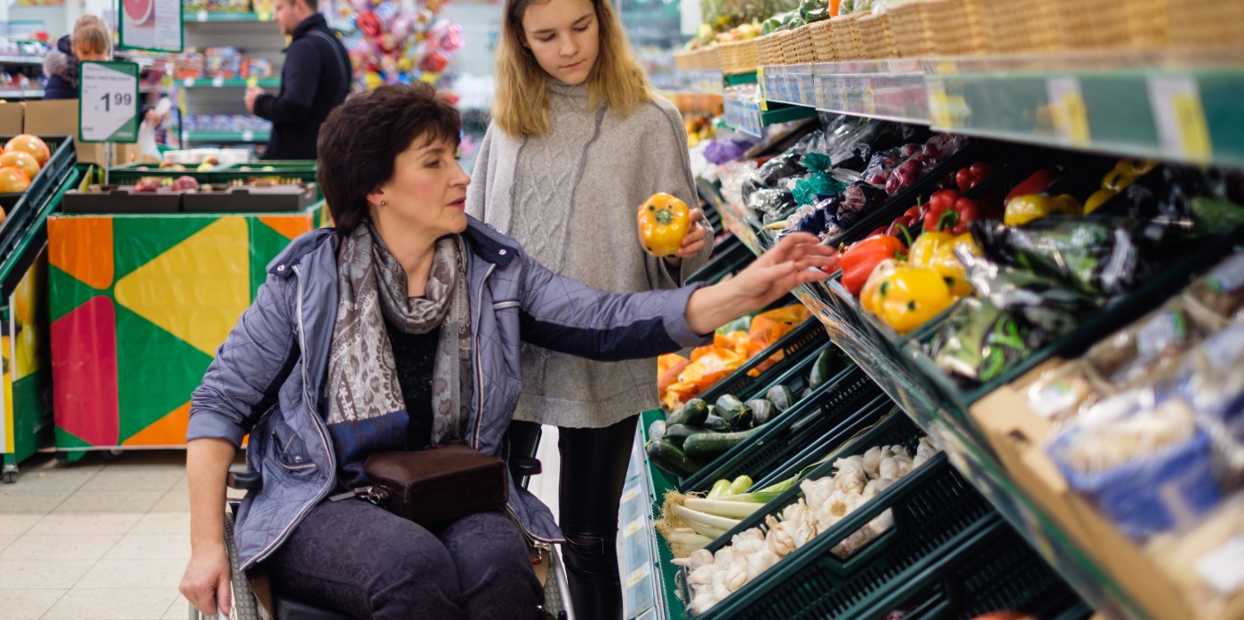 Idox Group News - Girl and disabled mother at a grocery store - Which? Fund Applications UK