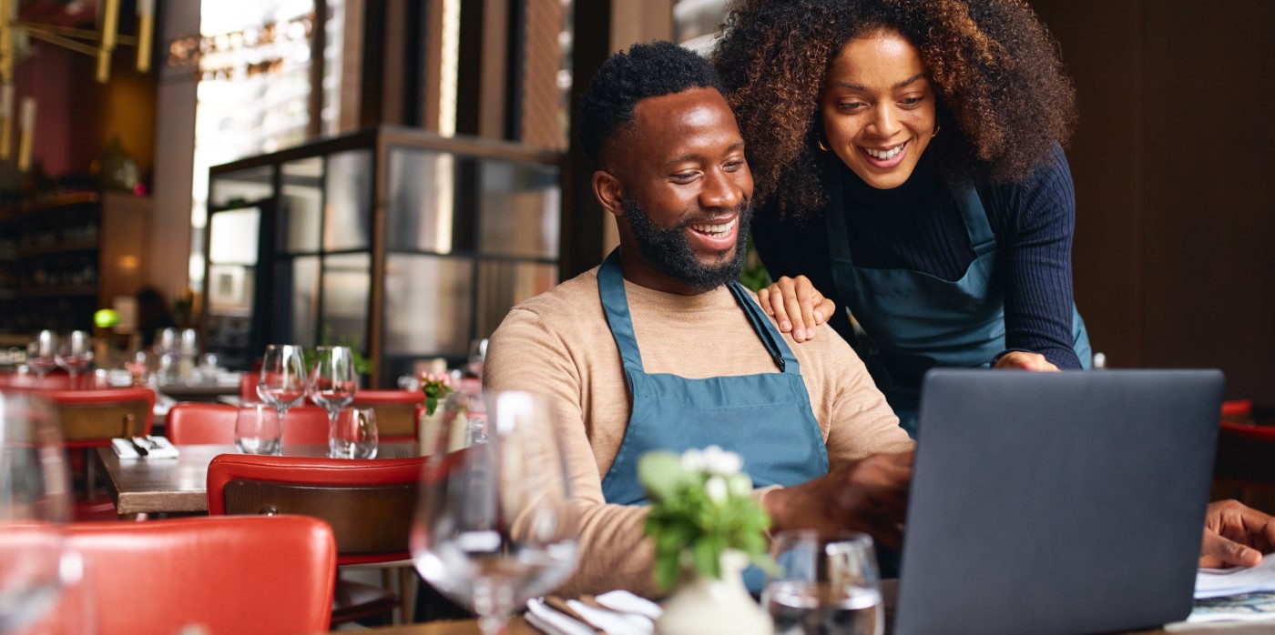 Idox Group News - Owners working in their restaurant - Funding for Black-owned Restaurant Businesses