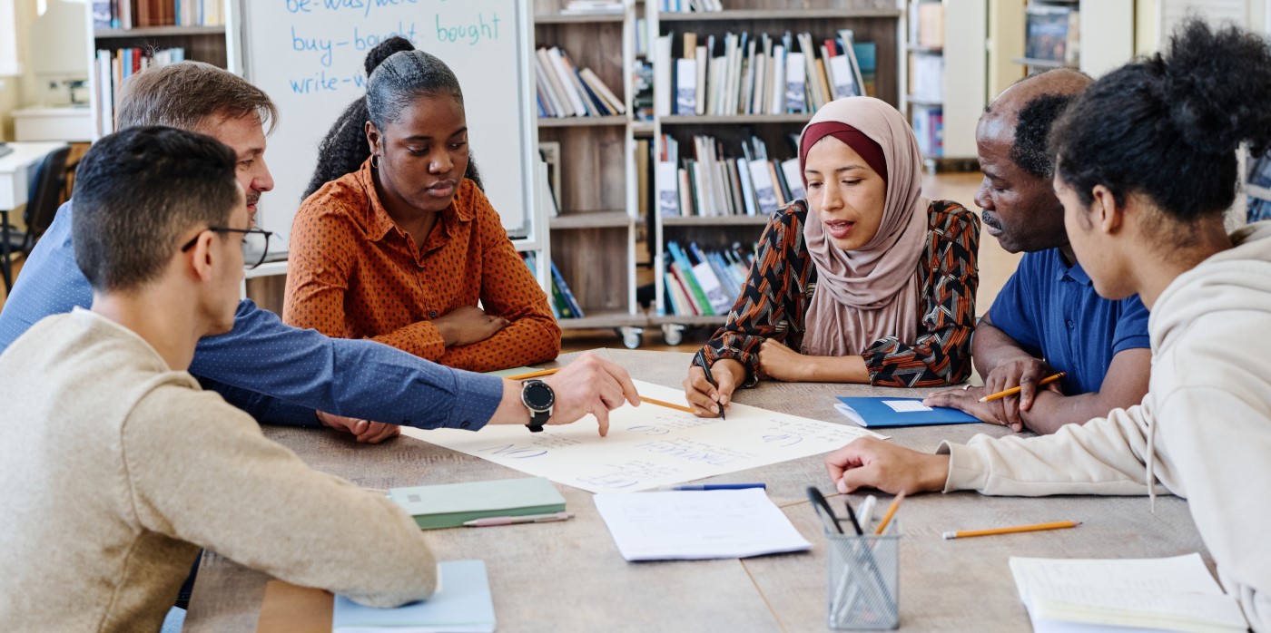 Idox Group News - Diverse students in a study group - Grants for Scottish Diaspora Communities