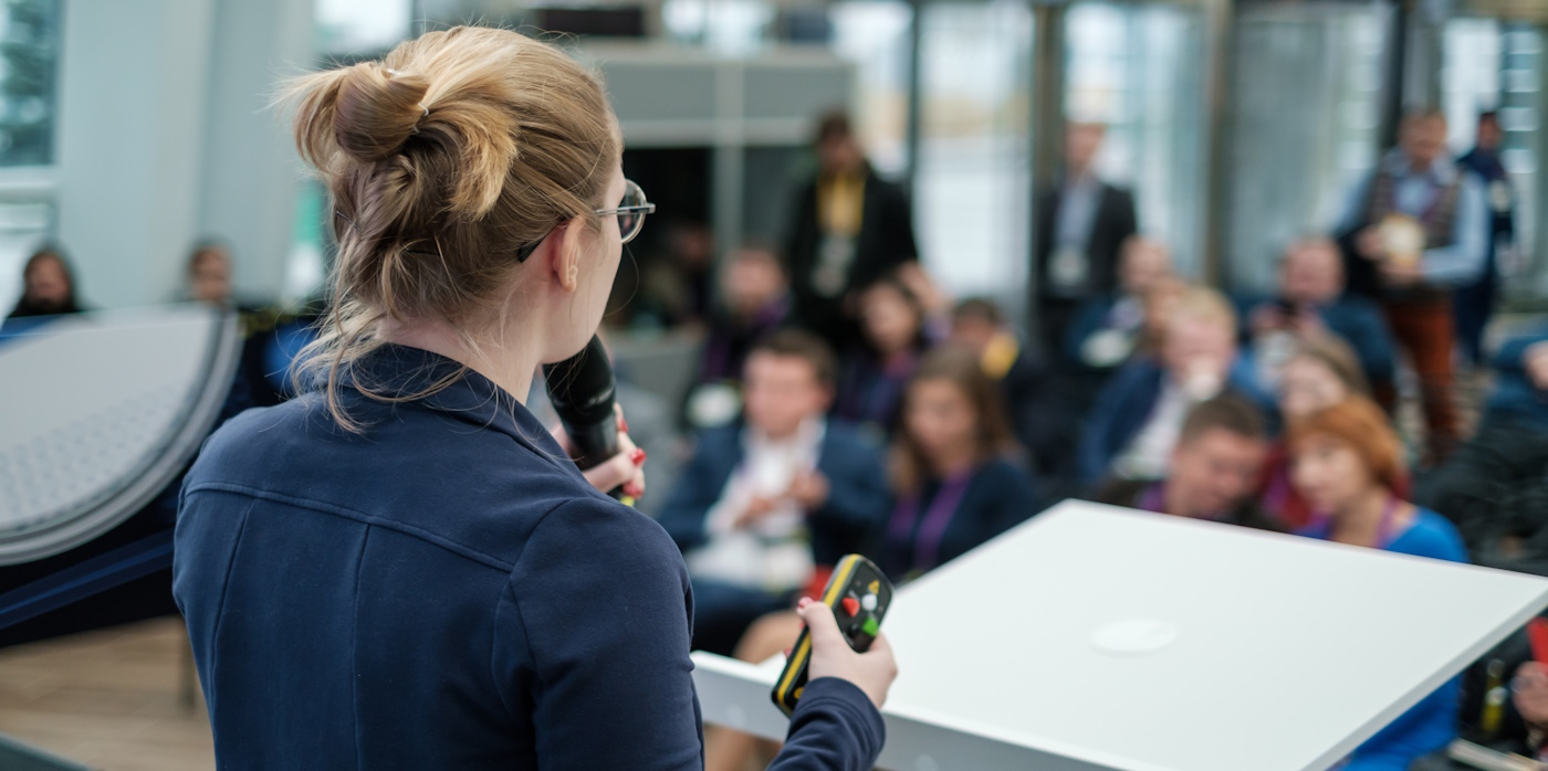 Young person presenting to a crowd